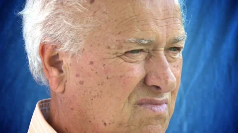 Closeup portrait of elderly man looking in the camera: relaxed old man portrait Stock Footage 64213969