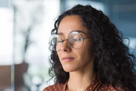 Closeup portrait female programmer engineer developer with closed eyes in Stock Photos