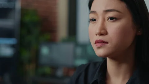 Closeup portrait of focused asian coder writing online cloud computing code and Stock Footage 168243468