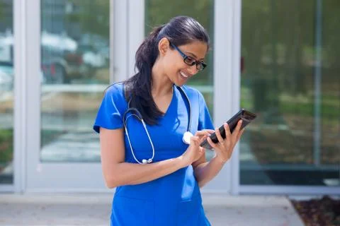 Closeup portrait of friendly, smiling confident female doctor in black glasse Stock Photos