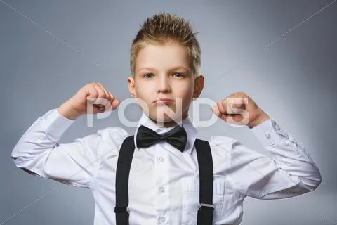 Closeup Portrait of Funny Little child. Sport Handsome Boy. Strong serious kid Stock Photos