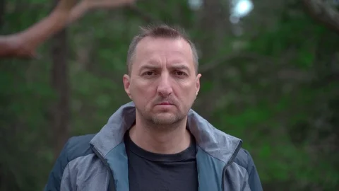 Closeup portrait of a man with a cleft lip looking at the camera and turns his Stock Footage 126774635