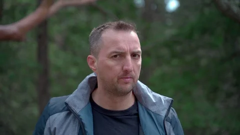 Closeup portrait of a man with a cleft lip looking at the camera and nodding his Video stock 126774685