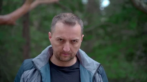 Closeup portrait of a man with a cleft lip looking at the camera and nodding his Stock Footage 126774690