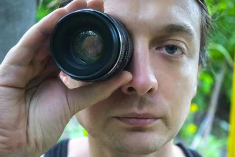 Closeup portrait man looking at camera lens Stock Photos