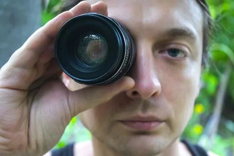 Closeup portrait man looking at camera lens Stock Photos