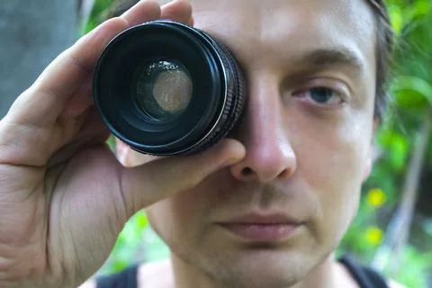 Closeup portrait man looking at camera lens Stock Photos
