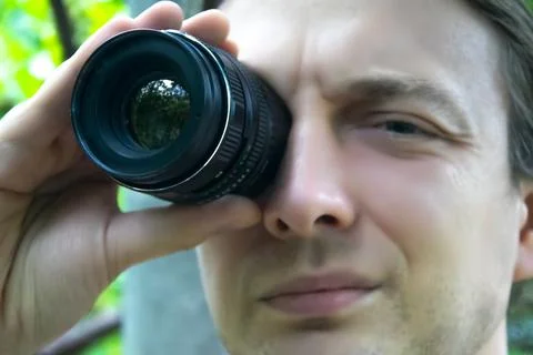 Closeup portrait man looking at camera lens Stock Photos