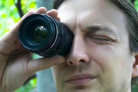Closeup portrait man looking at camera lens Stock Photos