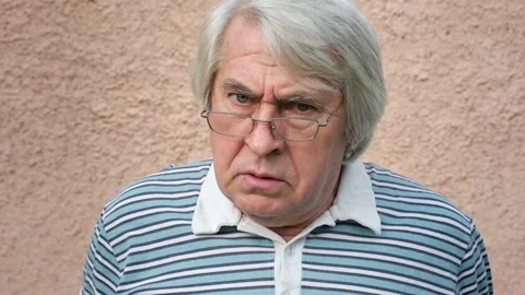 Closeup portrait of an old man looking very unhappy, mad and angry Video stock 208704059