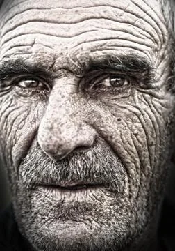 Closeup portrait of old man, wrinkled elderly skin, face Stock Photos