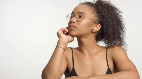 Closeup portrait s of young mixed race model with curly hair in studio with Stock Footage 111315679