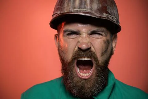 Closeup portrait screaming construction worker in hard hat. Angry builder in  Stock Photos