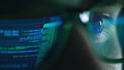 Closeup portrait of software engineer working on computer. Line of hack code run Stock Footage 197479760