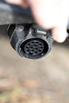 A closeup portrait of a thirteen pin socket on the back of a car to provide e Stock Photos