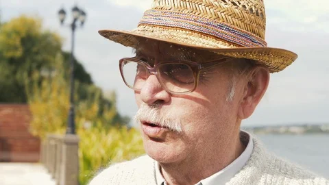 Closeup portrait of a very grumpy grouchy senior man.  Video stock 116306767