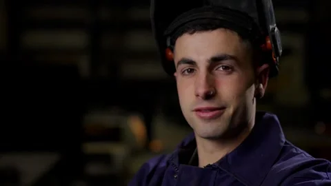 Closeup portrait of worker looking at camera Vídeos de archivo 267305930
