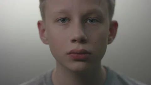A closeup portrait of a young boy drawing attention to the importance of wearing Stock Footage 130352352