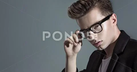 Closeup portrait of a young handsome man Stock Photos
