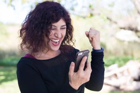 Closeup portrait, young happy business woman in black shirt standing, checkin Stock Photos