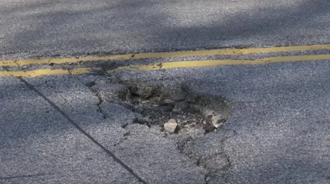 Closeup of pothole Stock Footage 51807365