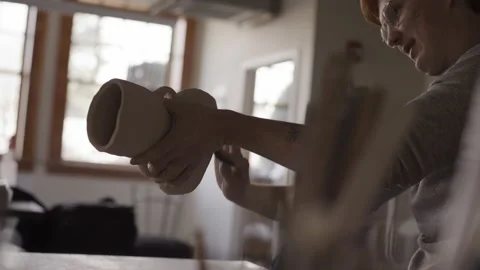 Closeup of potter working with ceramics in studio Stock Footage 235466816