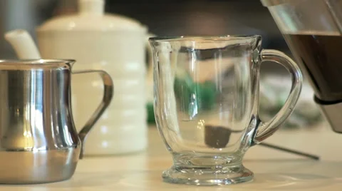 Closeup pouring coffee in a mug slow motion Stock Footage 38965632
