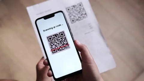 CloseUp POV of Using QR Code Scanner for Pay Online with Money Receipt and QR Stock Footage 197430902