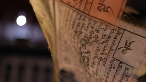 Closeup of prayer flag at night Видео 121663389