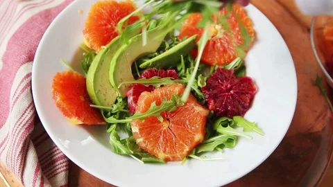 Closeup preparing orange salad with avocado Stock Footage 104812061
