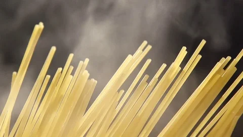 Closeup of preparing spaghetti in boiling water. Preparing pasta Stock Footage 72249699