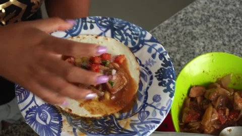 Closeup preparing tacos on a plate in the kitchen in 4k Video stock 194471717