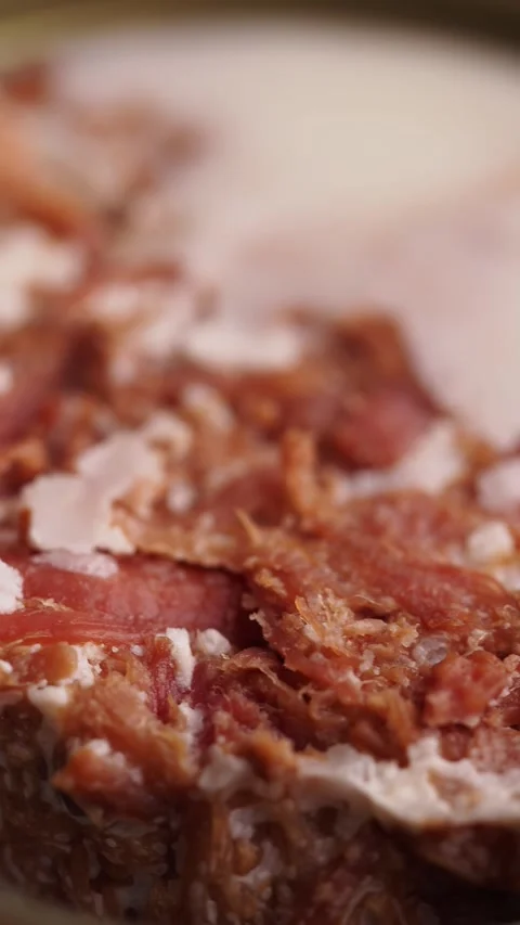 Closeup of preserved meat in a can container on table 動画素材 313032698
