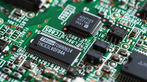Closeup of Printed Circuit Board with Electronic Components and Microchips Stock Footage 233073394