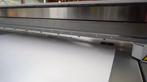 Closeup of the printhead track moving backwards over a calibration page Stock Footage 224935013
