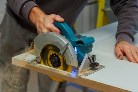 Closeup process of carpenter worker with circular saw Fotos Stock