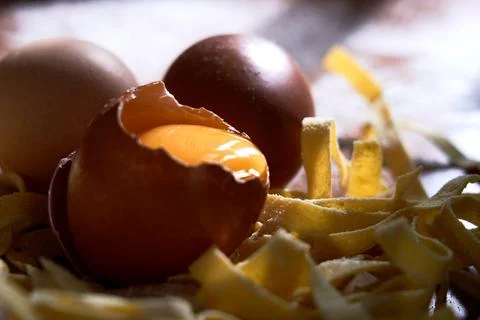 Closeup of process of making cooking homemade pasta. Raw homemade pasta and i Stock Photos