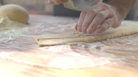 Closeup process making homemade pasta. Chef cook cutting with knife fresh dough Stock Footage 108072149