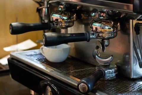 Closeup, professional coffee machine with bottomless filter Stock Photos