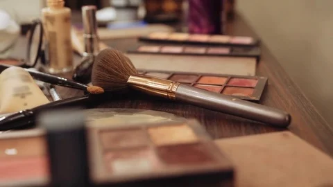 Closeup of professional cosmetics makeup brushes set kit in motion. Dolly view Stock Footage 81048541