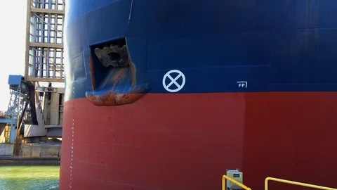 Closeup Profile of Huge Ship Moving Through Canal with Drawbridge in Back Video stock 91635895