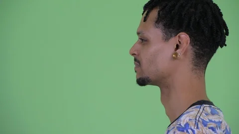 Closeup profile view of happy young African man being interviewed Stock Footage 111451290