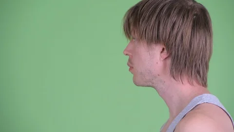 Closeup profile view of young man with messy hair thinking Stock-Footage 117781139