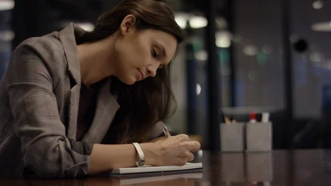 Closeup Profile Of Young Professional Taking Notes In Conference Room Stock Footage 97322420