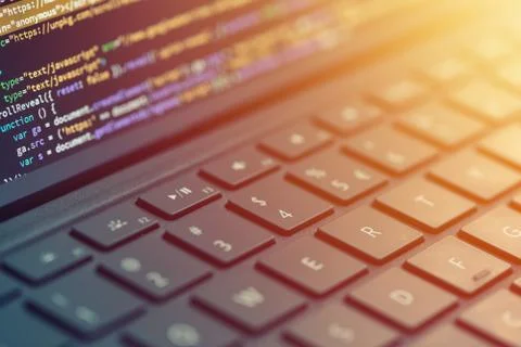 Closeup programmer coding on screen. Hands coding html and programming on laptop Foto stock