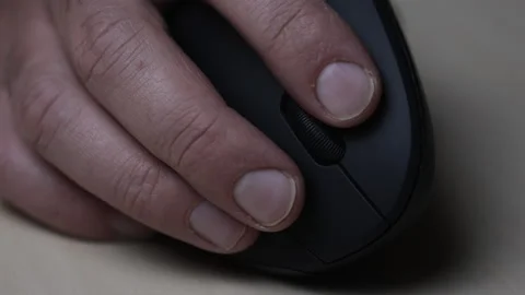 Closeup of programmer 's fingers on vertical mouse. Peripherals on workplace Stock Footage 164879213