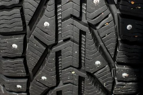 Closeup protector of used winter studded tires - wheel service Stock Photos