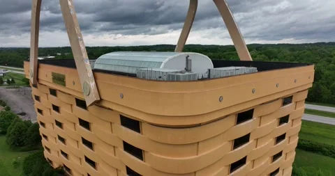 Closeup pull back flight viewing a building built to look like a basket Stock Footage 335671285