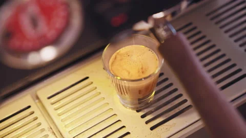Closeup of Pulling a shot of espresso from an espresso machine at a cafe shop Stock Footage 236948568