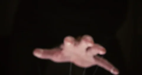 Closeup of a puppet hand with string tied around the fingers Video stock 95500783